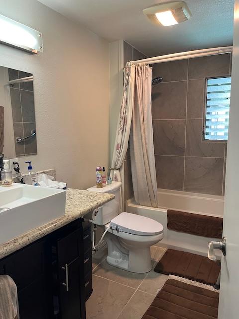 470 Hoopuni St, Hilo, HI 96720 - full bathroom featuring vanity, shower / tub combo with curtain, and tile patterned flooring