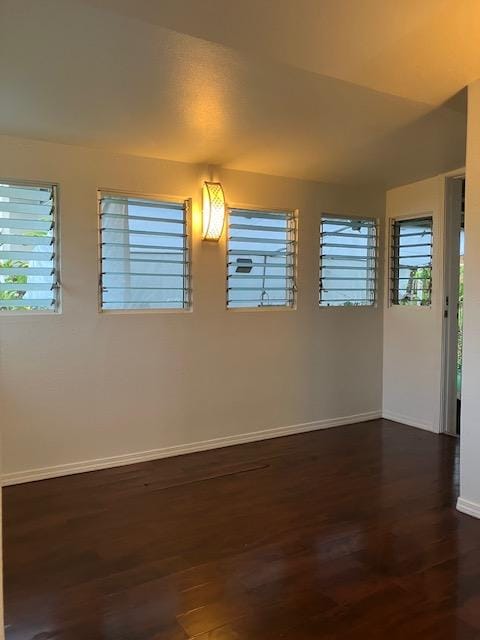 470 Hoopuni St, Hilo, HI 96720 - empty room with baseboards and dark wood-style floors