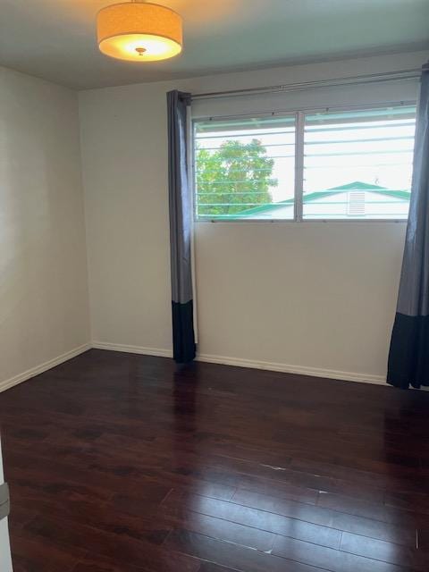 470 Hoopuni St, Hilo, HI 96720 - unfurnished room with dark wood-style flooring and baseboards