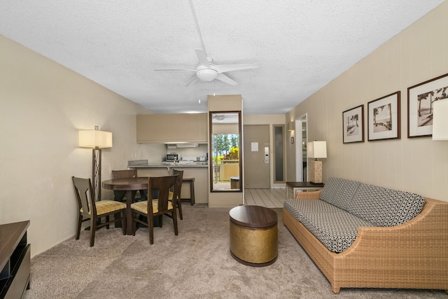 525 Aleka Lp Unit F6, Kapaa, HI 96746 - living area with ceiling fan, a textured ceiling, and light colored carpet