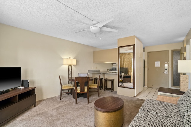 525 Aleka Lp Unit F6, Kapaa, HI 96746 - living area featuring a ceiling fan, light colored carpet, and a textured ceiling