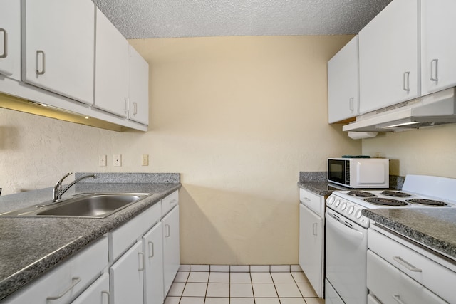 525 Aleka Lp Unit F6, Kapaa, HI 96746 - kitchen with white appliances, a sink, under cabinet range hood, white cabinets, and dark countertops