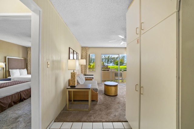 525 Aleka Lp Unit F6, Kapaa, HI 96746 - hallway featuring carpet flooring, a textured ceiling, and tile patterned flooring