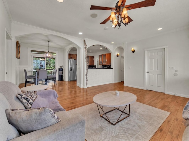 16-2069 Leilani Dr, Pahoa, HI 96778 - living area featuring arched walkways, light wood-type flooring, recessed lighting, a ceiling fan, and crown molding