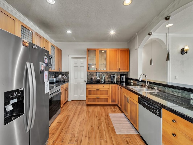 16-2069 Leilani Dr, Pahoa, HI 96778 - kitchen with appliances with stainless steel finishes, a sink, light wood-style floors, glass insert cabinets, and crown molding