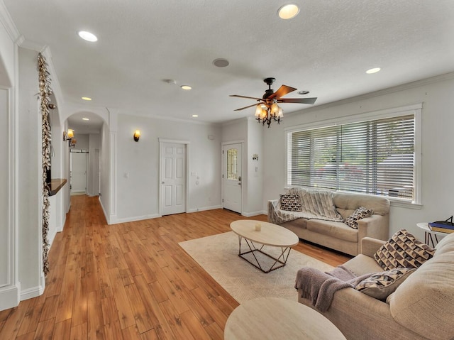 16-2069 Leilani Dr, Pahoa, HI 96778 - living room featuring arched walkways, ceiling fan, crown molding, recessed lighting, and light wood-style floors