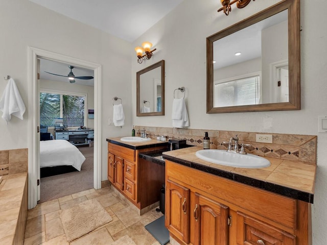 16-2069 Leilani Dr, Pahoa, HI 96778 - ensuite bathroom featuring two vanities, stone finish flooring, and a ceiling fan