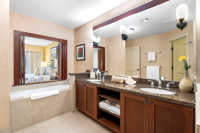 69-1033 Nawahine Pl Unit 1G, Waikoloa, HI 96738 - bathroom with double vanity, tile patterned floors, and a garden tub