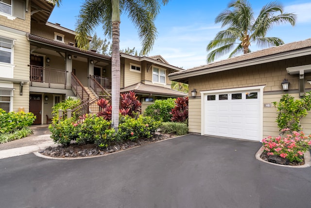 69-1033 Nawahine Pl Unit 1G, Waikoloa, HI 96738 - view of side of home with stairway and driveway