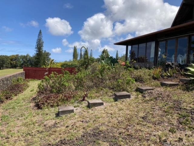 94-1790 Kaulua St, Naalehu, HI 96772 - view of yard with a sunroom