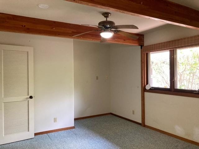 94-1790 Kaulua St, Naalehu, HI 96772 - spare room featuring a ceiling fan, carpet flooring, and beam ceiling