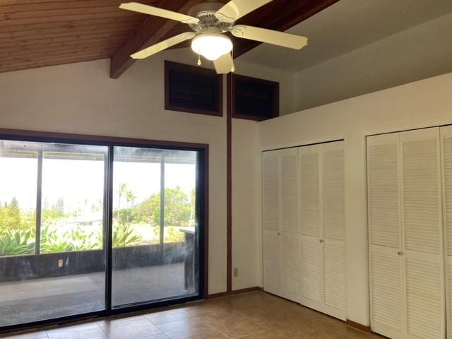 94-1790 Kaulua St, Naalehu, HI 96772 - unfurnished bedroom featuring two closets, access to outside, light tile patterned floors, ceiling fan, and a wood ceiling with exposed beams