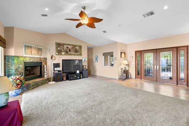 73-4571 Kukuki St Unit A, Kailua-Kona, HI 96740 - carpeted living area with a high end fireplace, a ceiling fan, vaulted ceiling, french doors, and recessed lighting