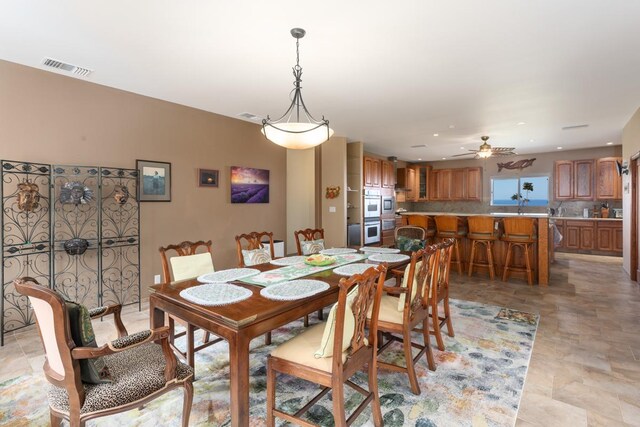 73-4571 Kukuki St Unit A, Kailua-Kona, HI 96740 - dining area with ceiling fan, stone finish floors, and recessed lighting