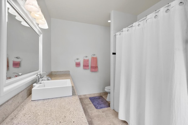73-4571 Kukuki St Unit A, Kailua-Kona, HI 96740 - bathroom featuring toilet, vanity, and baseboards