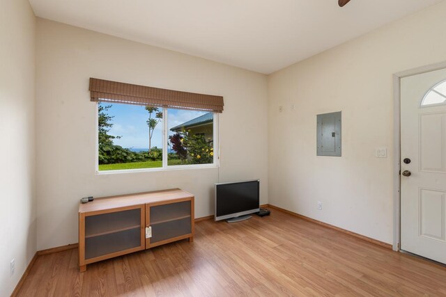 73-4571 Kukuki St Unit A, Kailua-Kona, HI 96740 - foyer entrance with healthy amount of natural light, electric panel, light wood finished floors, and baseboards