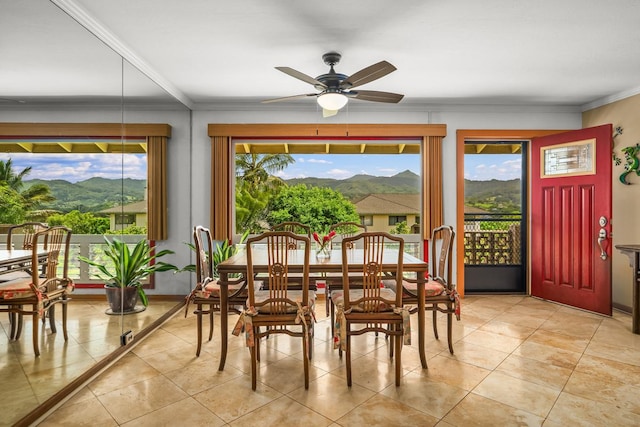 3875 Gallo Pl, Kalaheo, HI 96741 - dining room featuring a mountain view, a ceiling fan, ornamental molding, and light tile patterned flooring