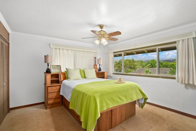 3875 Gallo Pl, Kalaheo, HI 96741 - carpeted bedroom featuring baseboards, a closet, ornamental molding, and ceiling fan