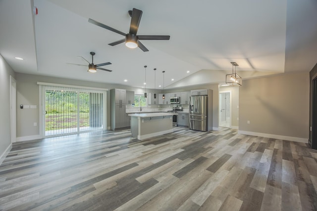 15-1674 24th Ave, Keaau, HI 96749 - unfurnished living room with vaulted ceiling, baseboards, light wood-type flooring, a ceiling fan, and recessed lighting