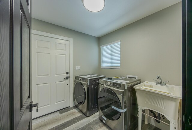 15-1674 24th Ave, Keaau, HI 96749 - laundry area with separate washer and dryer and light wood finished floors