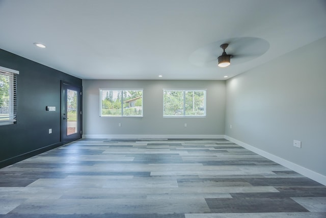 15-1674 24th Ave, Keaau, HI 96749 - unfurnished room featuring plenty of natural light, ceiling fan, recessed lighting, wood finished floors, and baseboards