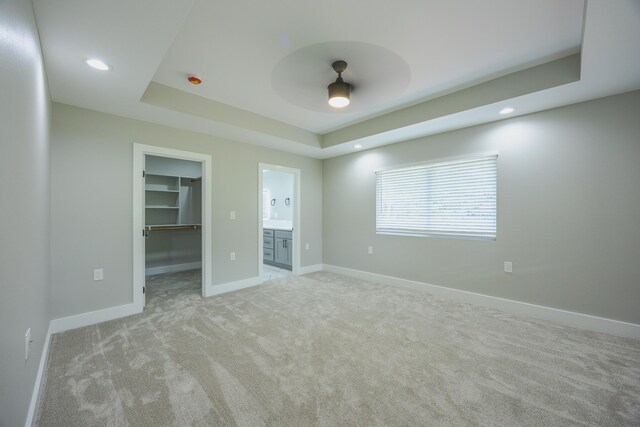 15-1674 24th Ave, Keaau, HI 96749 - unfurnished bedroom featuring a spacious closet, light colored carpet, a raised ceiling, baseboards, and recessed lighting
