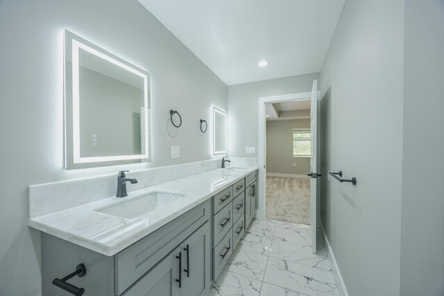 15-1674 24th Ave, Keaau, HI 96749 - bathroom featuring marble look tile flooring, baseboards, and double vanity