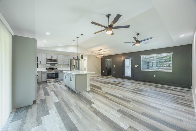 15-1674 24th Ave, Keaau, HI 96749 - kitchen with appliances with stainless steel finishes, lofted ceiling, a ceiling fan, light countertops, and a kitchen island