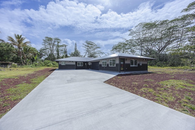 15-1674 24th Ave, Keaau, HI 96749 - single story home with concrete driveway and board and batten siding