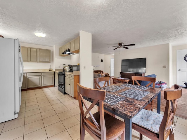 74-5156 Kialoa Pl, Kailua-Kona, HI 96740 - dining space with light tile patterned floors, a textured ceiling, and ceiling fan