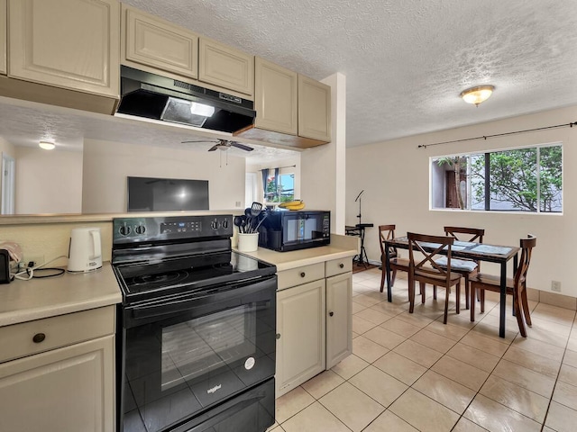 74-5156 Kialoa Pl, Kailua-Kona, HI 96740 - kitchen with black appliances, under cabinet range hood, cream cabinets, light countertops, and light tile patterned flooring
