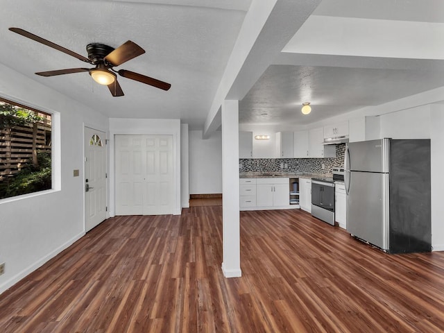 74-5156 Kialoa Pl, Kailua-Kona, HI 96740 - kitchen with stainless steel appliances, baseboards, under cabinet range hood, white cabinetry, and dark wood-style flooring