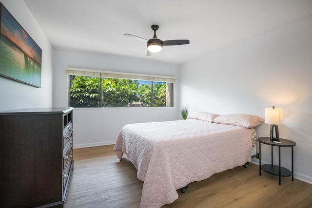 78-7070 Alii Dr Unit B202, Kailua-Kona, HI 96740 - bedroom with wood finished floors, baseboards, and ceiling fan