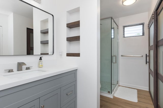 78-7070 Alii Dr Unit B202, Kailua-Kona, HI 96740 - bathroom with vanity, a stall shower, and wood finished floors