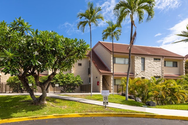 78-7070 Alii Dr Unit B202, Kailua-Kona, HI 96740 - view of front of home featuring a tiled roof, stone siding, and stucco siding
