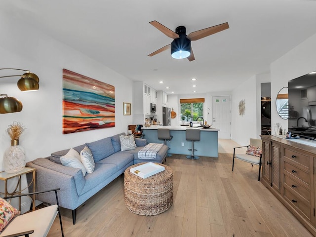 75-6009 Alii Dr Unit H2, Kailua-Kona, HI 96740 - living room featuring stacked washer / drying machine, ceiling fan, light wood-type flooring, and recessed lighting