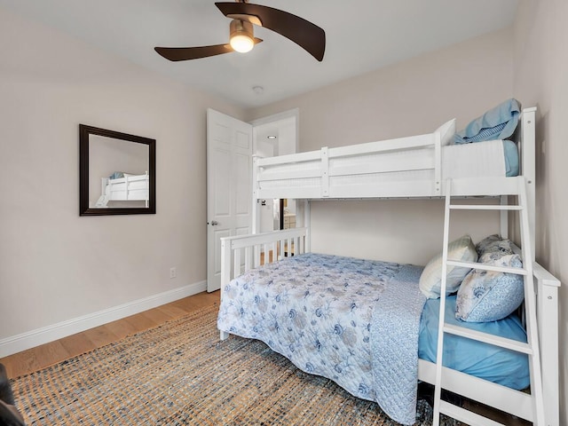 75-6009 Alii Dr Unit H2, Kailua-Kona, HI 96740 - bedroom featuring wood finished floors, baseboards, and a ceiling fan