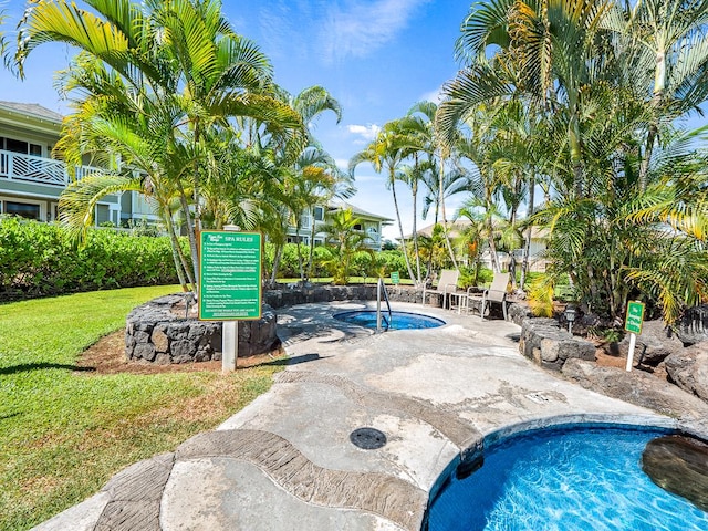 75-6009 Alii Dr Unit H2, Kailua-Kona, HI 96740 - view of pool with a lawn, a swimming pool, and a patio area