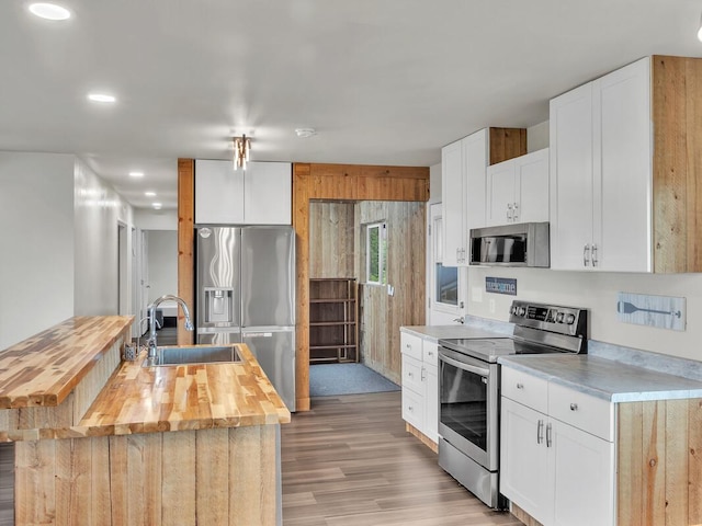 74-5071 Kealapua St, Kailua-Kona, HI 96740 - kitchen with stainless steel appliances, wooden counters, a sink, light wood-type flooring, and recessed lighting