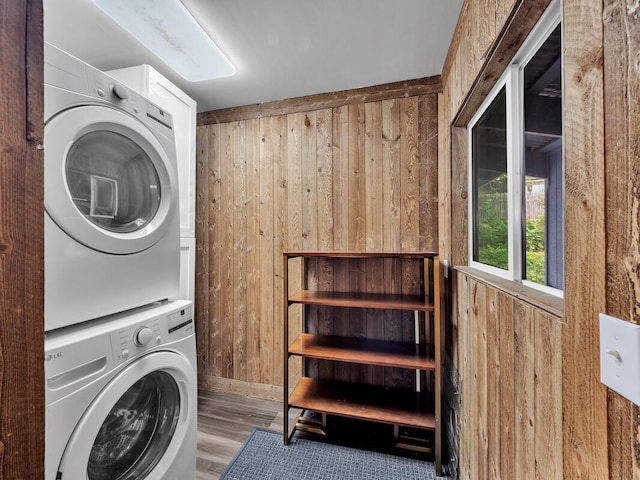 74-5071 Kealapua St, Kailua-Kona, HI 96740 - washroom featuring stacked washer / drying machine, wood walls, wood finished floors, and baseboards