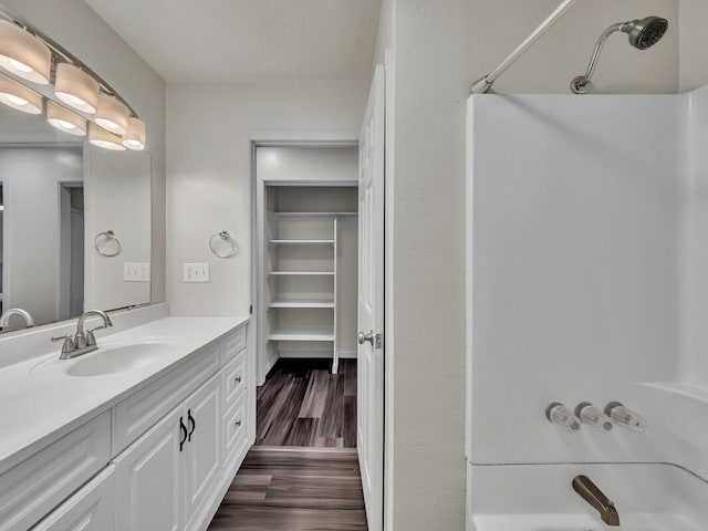 74-5071 Kealapua St, Kailua-Kona, HI 96740 - full bath with vanity, bathing tub / shower combination, and wood finished floors