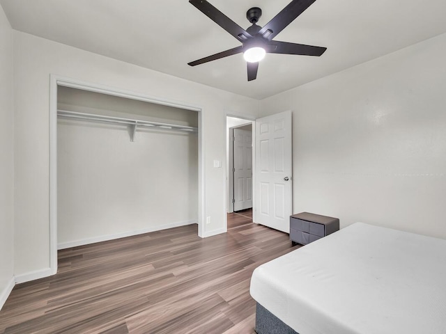 74-5071 Kealapua St, Kailua-Kona, HI 96740 - bedroom featuring wood finished floors, a closet, baseboards, and a ceiling fan