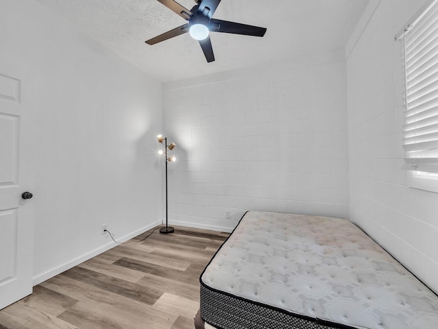 74-5071 Kealapua St, Kailua-Kona, HI 96740 - bedroom featuring light wood-style floors, a ceiling fan, and baseboards