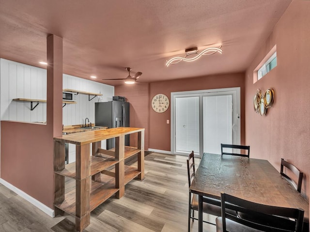 74-5071 Kealapua St, Kailua-Kona, HI 96740 - dining room featuring wood finished floors, a ceiling fan, and baseboards
