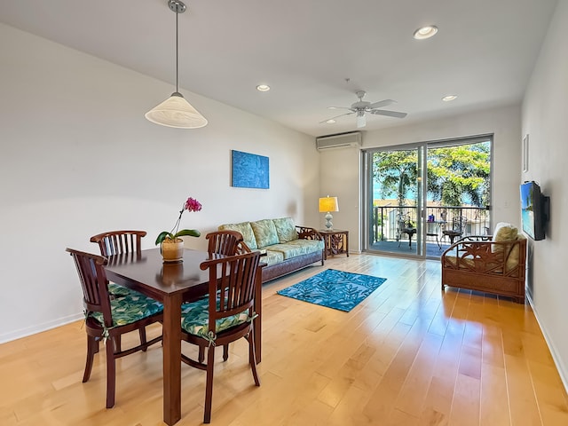 75-346 Hualalai Rd Unit B202, Kailua-Kona, HI 96740 - dining area featuring a wall mounted AC, recessed lighting, a ceiling fan, and light wood-type flooring