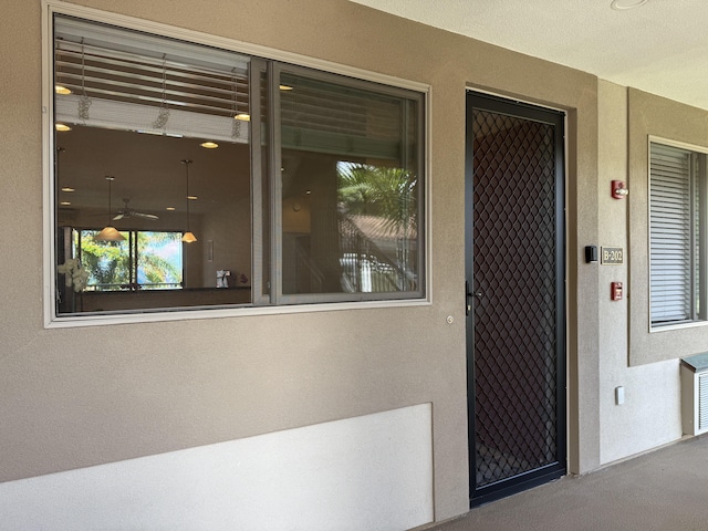 75-346 Hualalai Rd Unit B202, Kailua-Kona, HI 96740 - view of exterior entry featuring stucco siding