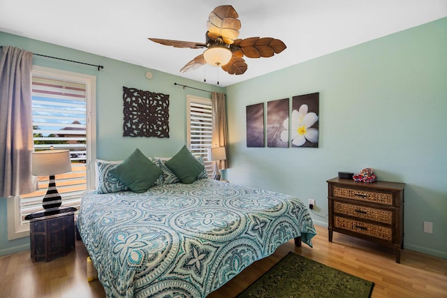 4461 Kamoa Rd Unit B22, Kapaa, HI 96746 - bedroom featuring wood finished floors, a ceiling fan, and baseboards