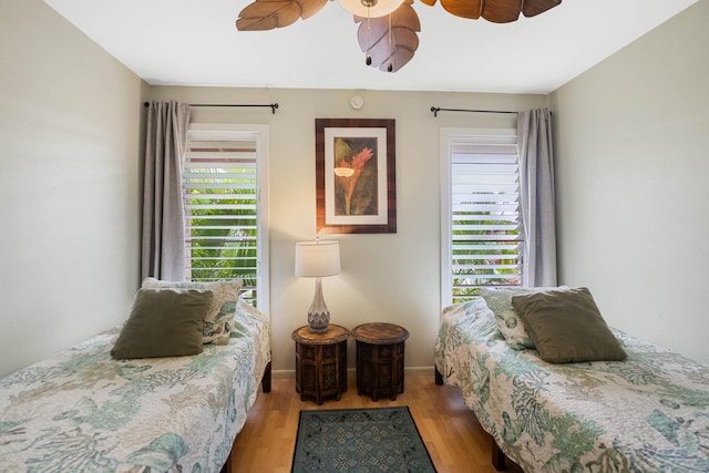 4461 Kamoa Rd Unit B22, Kapaa, HI 96746 - bedroom with wood finished floors, a ceiling fan, and baseboards