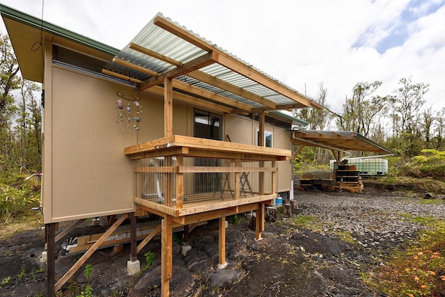 11-2317 Kokokahi Rd, Volcano, HI 96785 - back of property with stucco siding and a carport