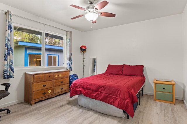 11-3458 Lehua St, Mountain View, HI 96771 - bedroom with light wood-style floors, baseboards, and ceiling fan